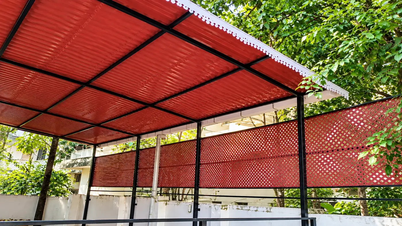 Red lattice roofing and privacy screens installed in Chennai